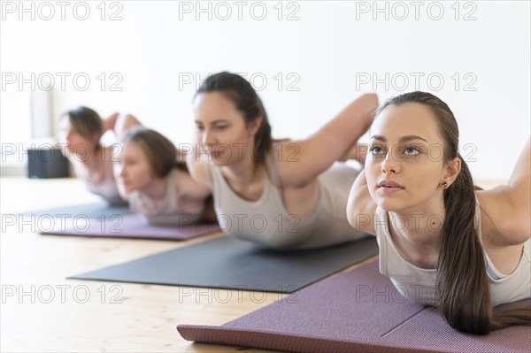 Yoga teacher teaching class 10