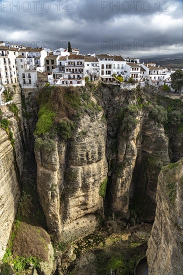 The white houses of the old town La Ciudad on a rocky plateau above the gorge Tajo de Ronda