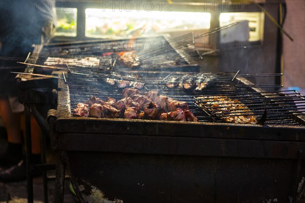 Fish and meat on a grill of a restaurant in the old town of Lisbon