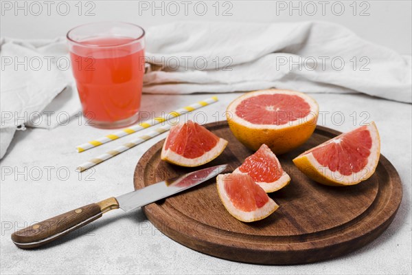 High angle grapefruit slices with juice