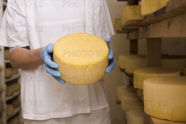 Man holding cheese roll