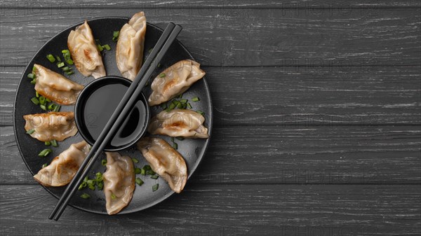 Traditional dumplings plate with chopsticks