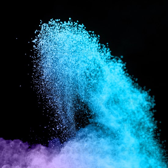 Blue burst powder dark background