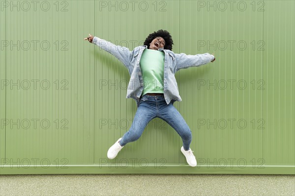 Portrait young female jumping