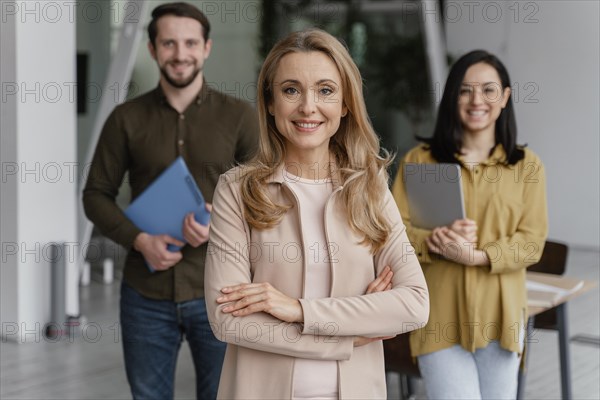 Smiley coworkers posing together office