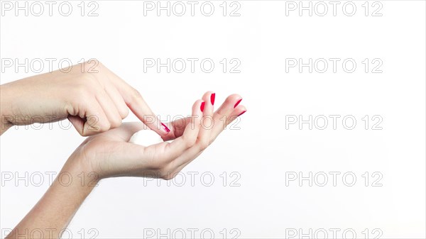 Woman s hand with moisturizer isolated white background