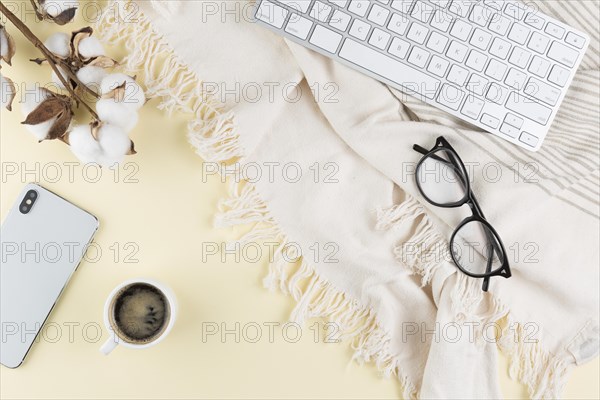 Top view desk with glasses smartphone