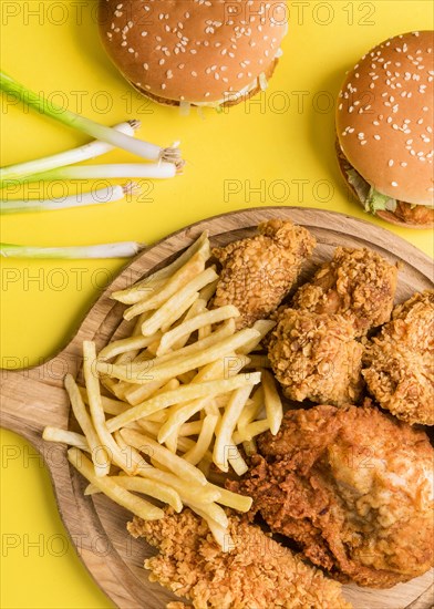 Top view fried chicken fries with burgers green onions