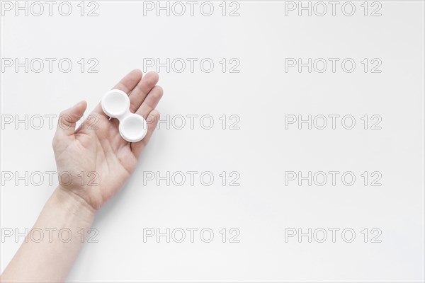 Container lenses hand white background
