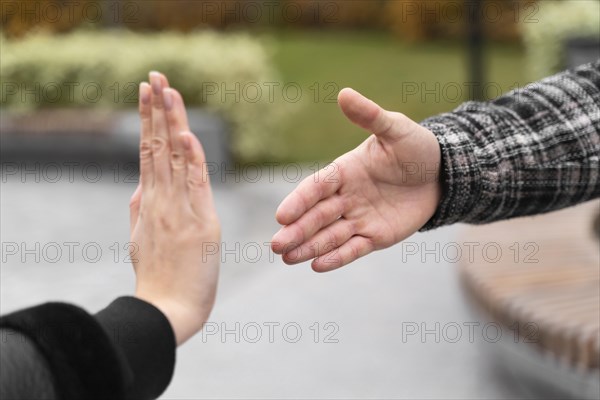 Person refusing shake hands protection