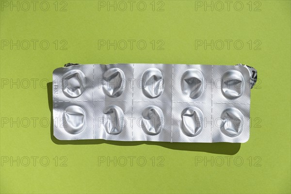 Empty tablet blister pack against a monochrome background