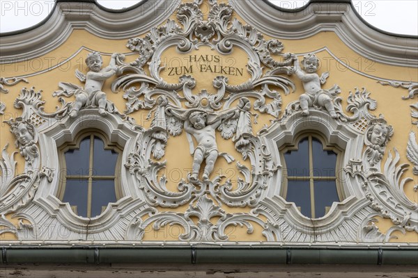 Facade view of the Falkenhaus with stucco facade in rococo style in the centre of Wuerzburg