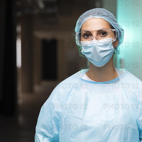 Female doctor wearing protective clothing