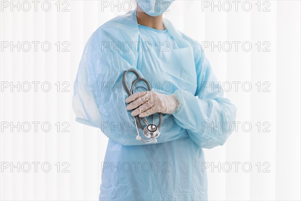 Front view female doctor wearing protective clothing
