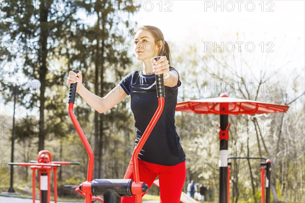 Young woman doing outdoors excercises