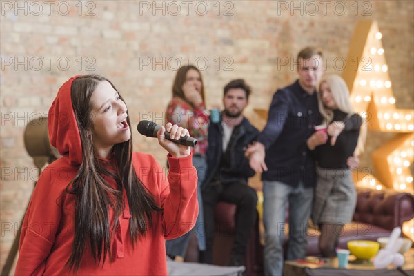 Friends singing karaoke party