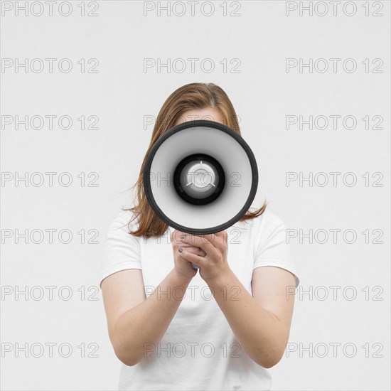 Front view girl screaming megaphone