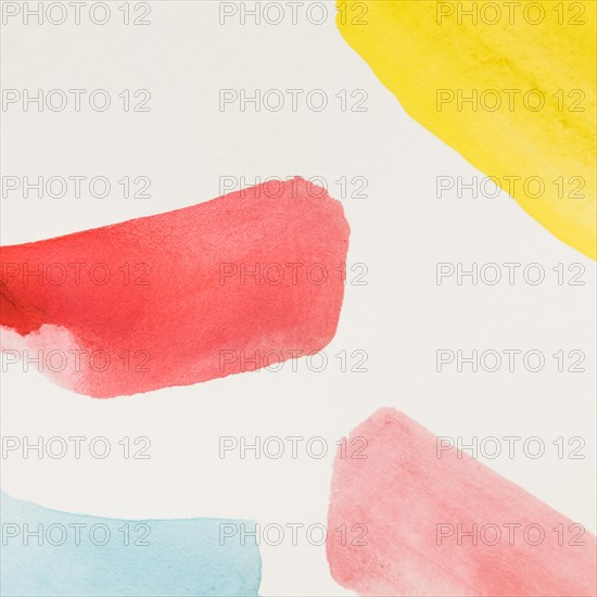 Different yellow red blue brush stroke watercolor white background