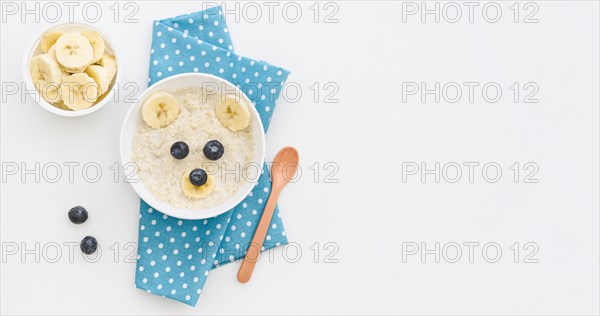 Top view milk oat flakes with fruits with copy space