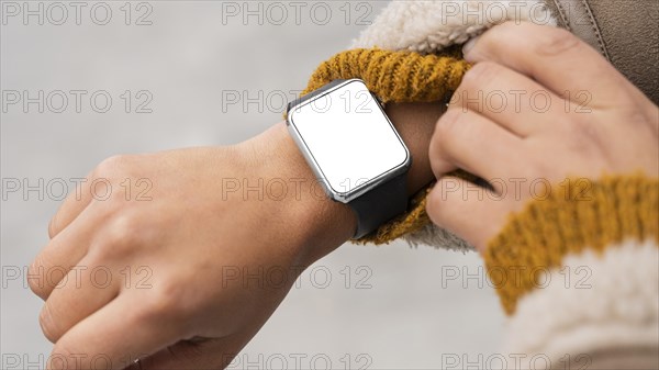 Woman wearing blank smartwatch