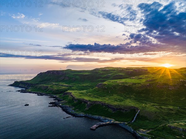 Sunset over Calgary Beach and Bay from a drone