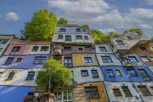 Green and colourful facade of the Hundertwasser House
