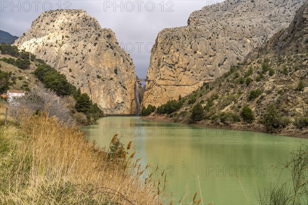 Suspension bridge and waterfall of the via ferrata Caminito del Rey near El Chorro