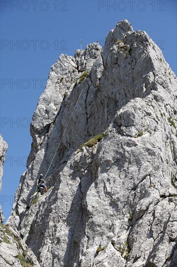 Climber abseiling on the Rossstein Needle