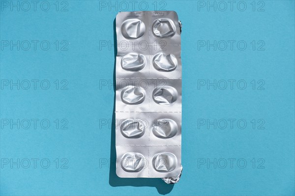 Empty tablet blister pack against a monochrome background