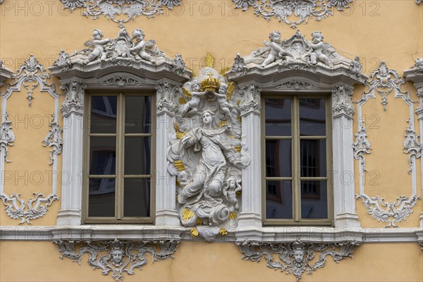 Facade view of the Falkenhaus with stucco facade in rococo style in the centre of Wuerzburg