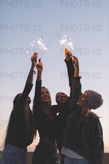 Friends with sparklers evening