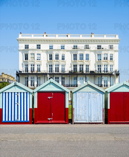 Row of beautiful colourful seaside bathing cottages in Brighton and Hove