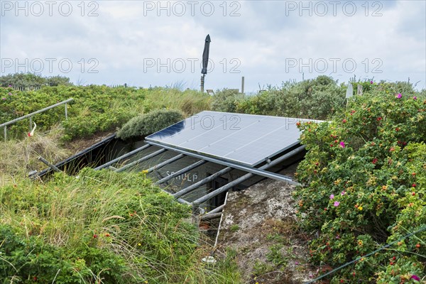 Solar panel above a former bunker of the German Wehrmacht on the North Sea island of Terschelling