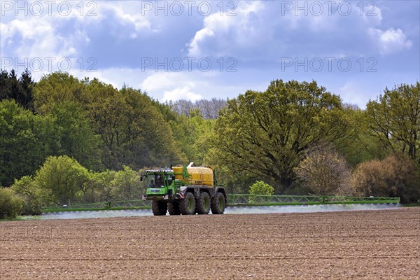 Farmer spraying pesticides