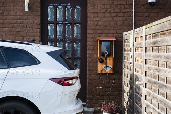 A car being charged at a public charging station