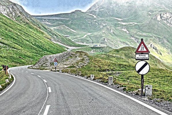 Photo with reduced dynamic range saturation HDR with view of from mountain pass alpine mountain road alpine road pass road pass old Grossglockner High Alpine Road Grossglockner High Alpine Road above above tree line