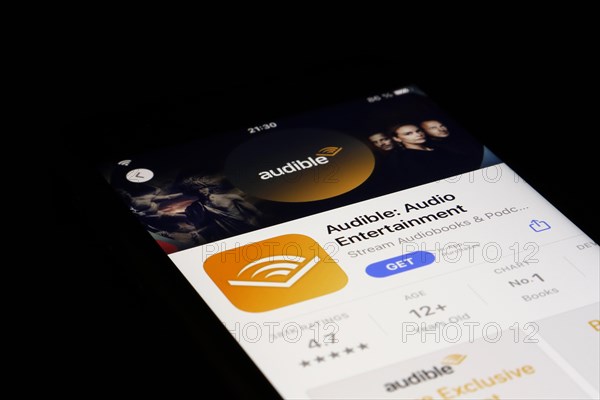 Detailed view of a smartphone with Audible app in the iPhone App Store