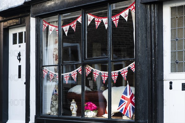 Window with Union Jack flags on the occasion of the coronation of King Charles in Rye