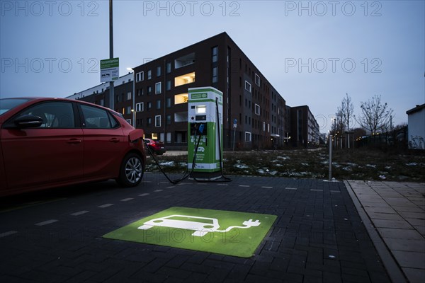 An e-car charges at a public charging station in Duesseldorf