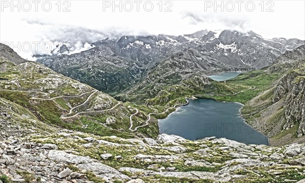 Photo with reduced dynamic range saturation HDR of view of serpentines with hairpin bends from Colle del Nivolet