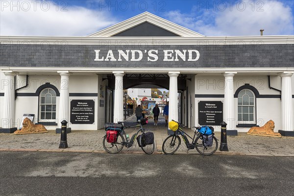 Two e-bikes in front of Land's End Visitor Centre