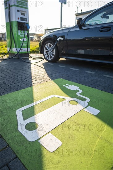 An e-car charges at a public charging station in Duesseldorf