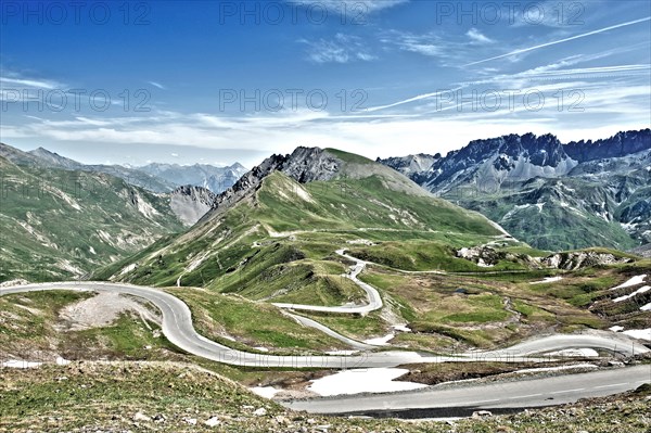 Photo with reduced dynamic saturation HDR of mountain pass alpine mountain road alpine road pass road pass in French Alps