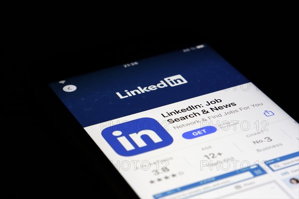 Detailed view of a smartphone with Linkedin app in the iPhone App Store