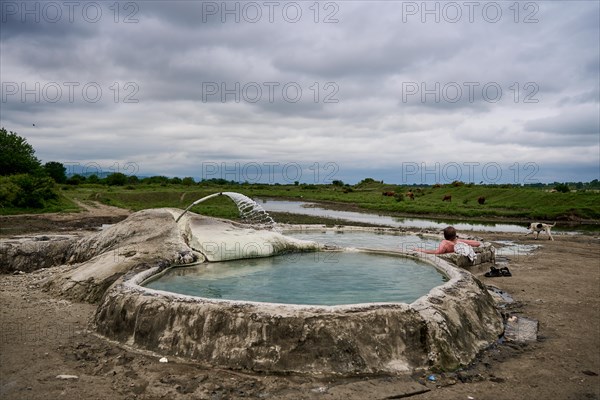 Tourist bathing in springs of Amaghleba