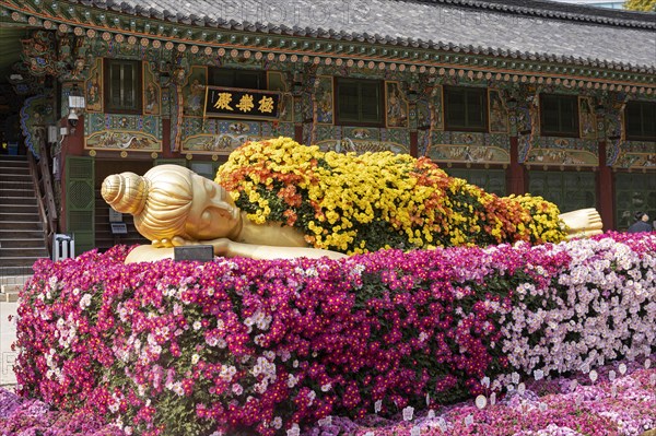 Buddha statue decorated with flowers