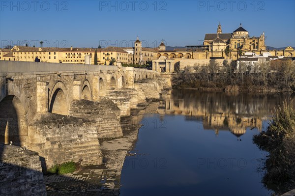 Roman bridge over the river Rio Guadalquivir and the Mezquita