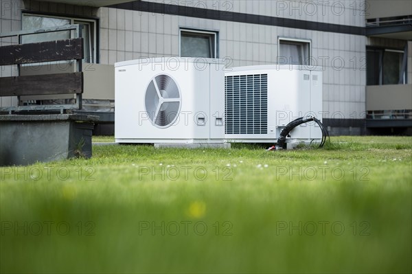 Two heat pumps on a lawn of an apartment building in Duesseldorf