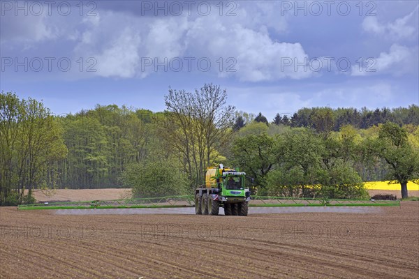 Farmer spraying pesticides