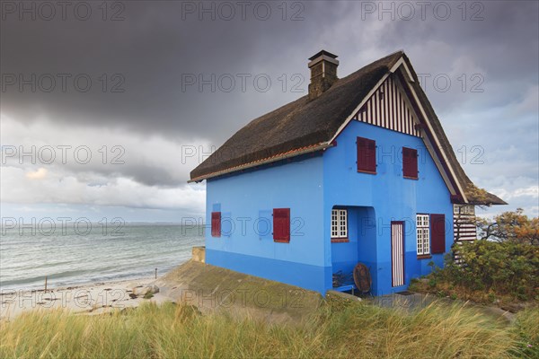 Blue beach house on the peninsula Graswarder